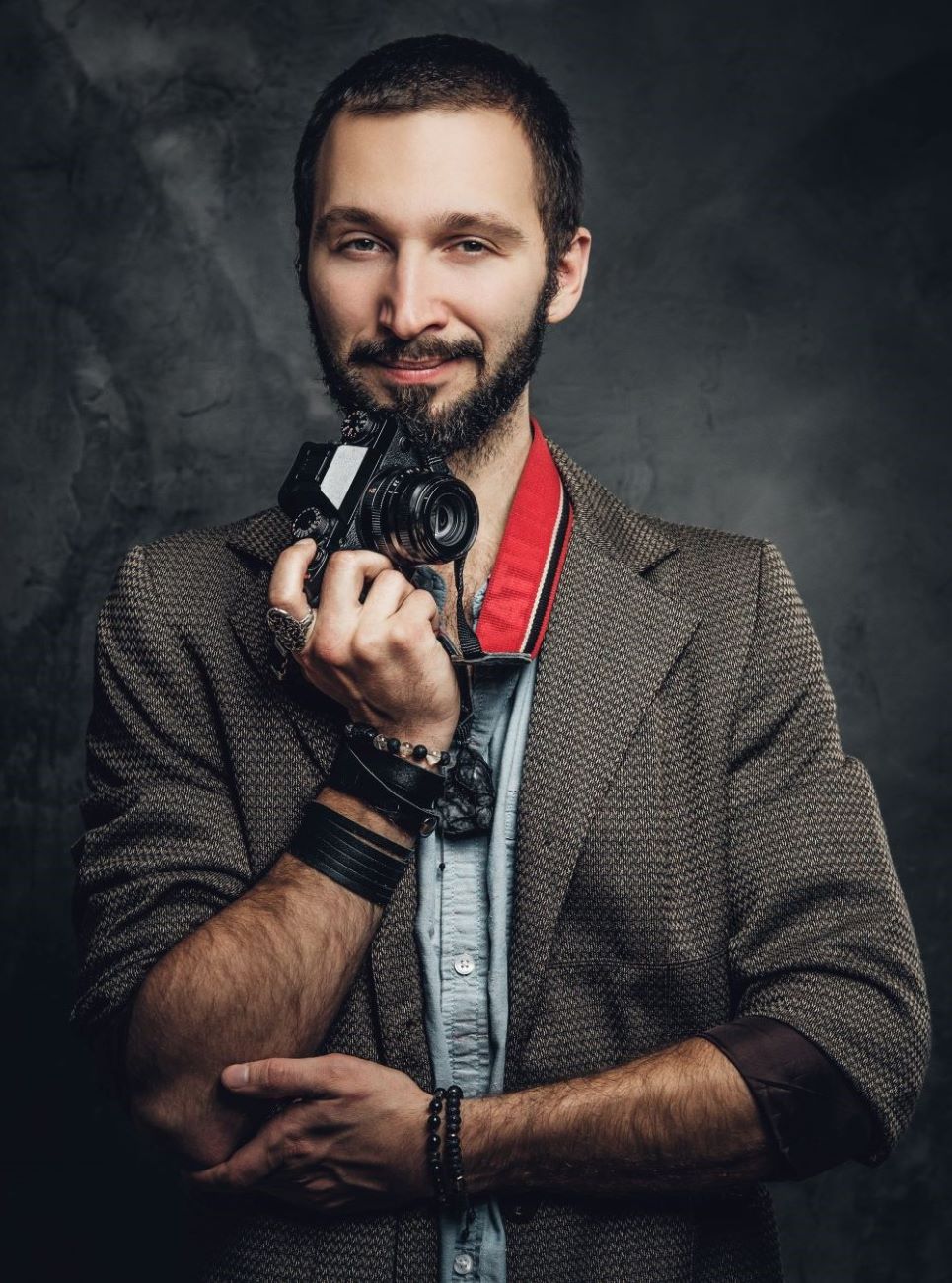 man-is-posing-for-photographer-with-photo-camera-2023-11-27-05-20-06-utc-1.jpg