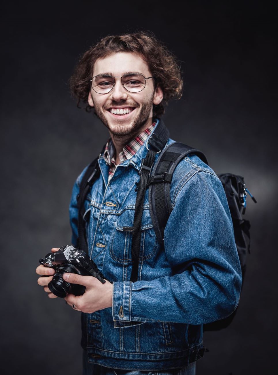 portrait-of-a-handsome-young-photographer-with-cur-2023-11-27-05-18-00-utc-1.jpg